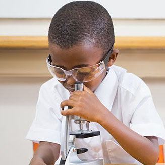 A child exploring materials at Laurelwood